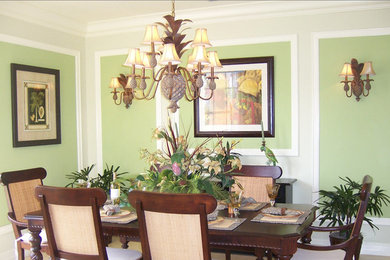 Inspiration for a dining room remodel in Miami with green walls