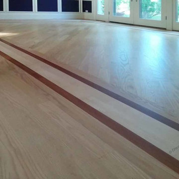 Red oak hardwood flooring with maple and Brazilian cherry border