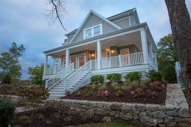 Mid-sized beach style gray two-story wood exterior home photo in New York with a shingle roof