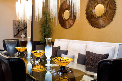 Example of a large trendy dark wood floor and brown floor enclosed dining room design in San Diego with yellow walls and no fireplace