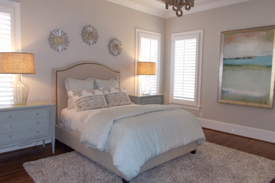 Inspiration for a mid-sized transitional master dark wood floor and brown floor bedroom remodel in Other with beige walls