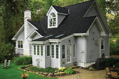 Inspiration for a large craftsman gray two-story wood gable roof remodel in San Diego