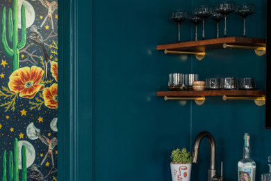 Wet bar - mid-sized modern dark wood floor and brown floor wet bar idea in Austin with an undermount sink, flat-panel cabinets, blue cabinets, quartz countertops and white countertops