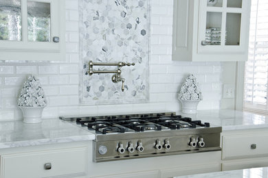 Kitchen - contemporary kitchen idea in Dallas with beaded inset cabinets, white cabinets, marble countertops, white backsplash, subway tile backsplash and stainless steel appliances