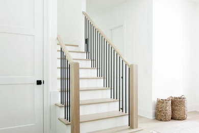 Example of a mid-sized trendy wooden u-shaped wood railing staircase design in Chicago with painted risers