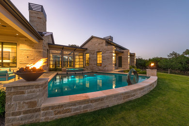 Mid-sized trendy stamped concrete and custom-shaped pool photo in Other