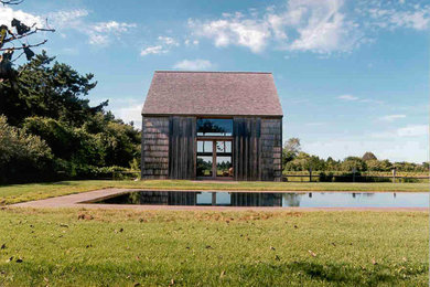 Photo of an expansive country home design in New York.