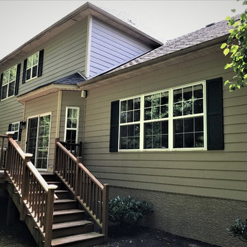 Replacing Stucco with James Hardie Khaki Brown 81/4 inch Cedarmill Planks in Doy