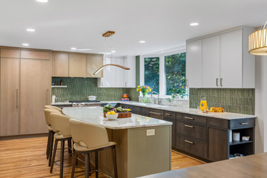 Inspiration for a large contemporary l-shaped medium tone wood floor eat-in kitchen remodel in DC Metro with green backsplash, an island and beige countertops