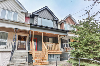 Mid-sized modern gray two-story brick exterior home idea in Toronto with a shingle roof