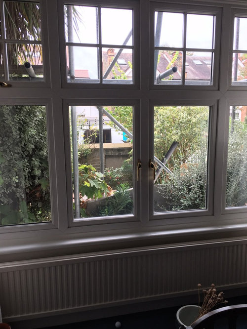 Square Bay window covering radiator below Houzz UK