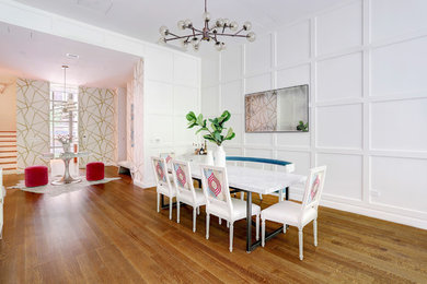 Transitional dining room in Miami with white walls, medium hardwood floors and no fireplace.