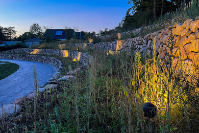 Landhausstil Gartenmauer mit Pflastersteinen in Hamburg