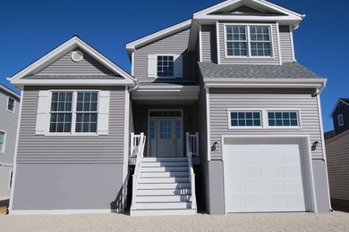 Example of a beach style home design design in New York