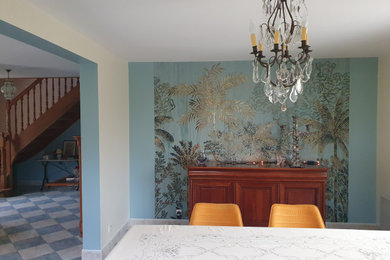 This is an example of a medium sized classic dining room in Other with blue walls, ceramic flooring, blue floors and wallpapered walls.