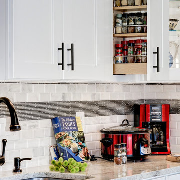 White Kitchen Remodel with Colonial White Granite and Stainless Steel Appliances