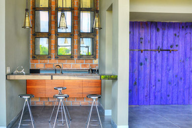 Inspiration for a large modern vestibule in Los Angeles with ceramic floors, a double front door and a purple front door.