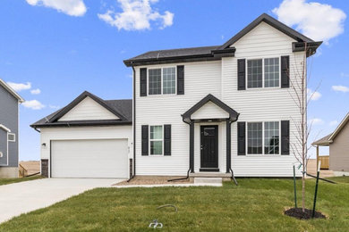Large white two-story vinyl exterior home photo in Other with a shingle roof
