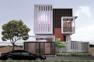 Mid-sized black three-story concrete flat roof photo in Other