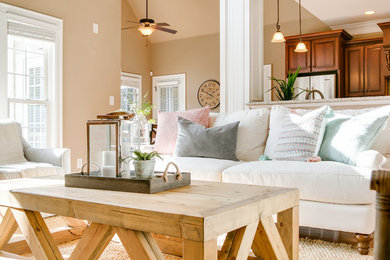 This is an example of a beach style living room in Raleigh.