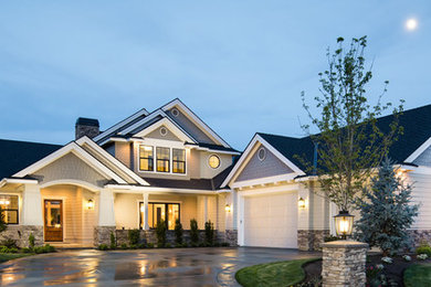 Inspiration for a large timeless gray two-story wood exterior home remodel in Cleveland