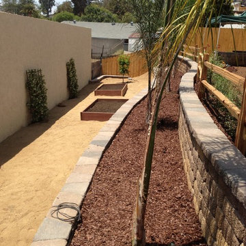 Country manor firepit, seatwalls, terraced retaining walls, and paver patio