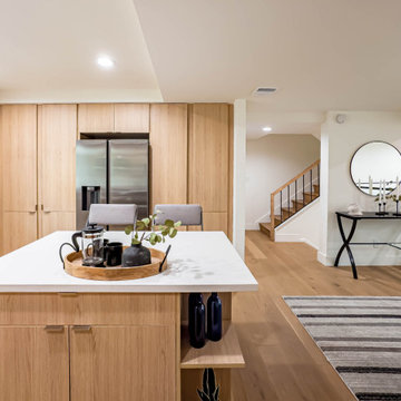 Quartz Island with Bar Seating and Open Stair Beyond