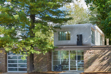 Small mid-century modern beige one-story mixed siding flat roof idea in DC Metro with a green roof and a brown roof