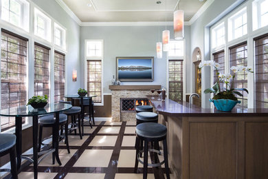This is an example of a mid-sized transitional home bar in Orange County.