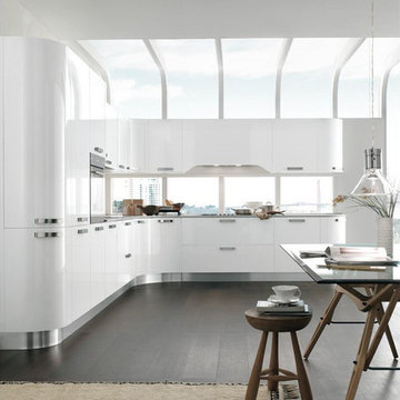 Modern white high gloss kitchen with curved cabinets