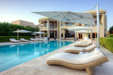 Large trendy pool photo in Other