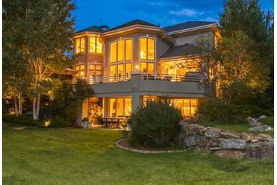 Example of a huge classic walk-out basement design in Denver