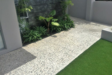 Inspiration for a large modern front yard full sun driveway in Perth with a garden path.