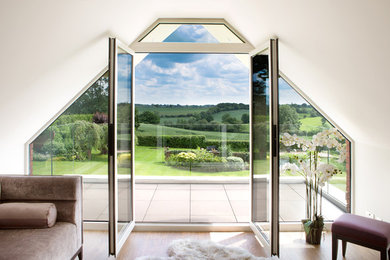 Medium sized traditional master bedroom in West Midlands with white walls.