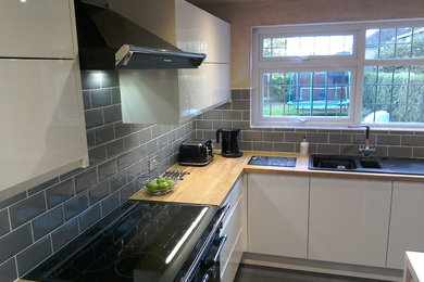 White Gloss Handle less kitchen fitted in Romford