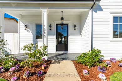 Example of a large beach style white two-story house exterior design in Los Angeles
