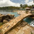 Lake House Pool with a 40' vanishing edge and a carved concrete slide