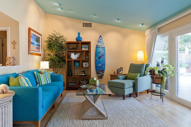 Mid-sized island style living room photo in Los Angeles with orange walls