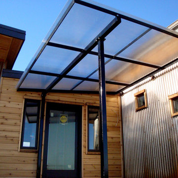 Crimson Bluffs Home- Custom Designed & Fabricated Awnings and Railing