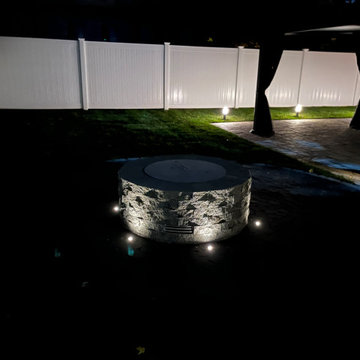 Backyard Makeover with Paver Patio, Pergola, Fire Place and Outdoor Lights.