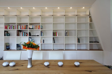 Design ideas for a traditional living room in Frankfurt with a library.