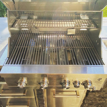 Outdoor kitchen and pass through gas fireplace