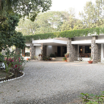 The Entry, flanked by orchards of litchi and jackfruit trees