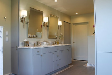 Inspiration for a large transitional master gray tile and ceramic tile porcelain tile corner shower remodel in Los Angeles with flat-panel cabinets, gray cabinets, an undermount tub, a two-piece toilet, green walls, an undermount sink and marble countertops