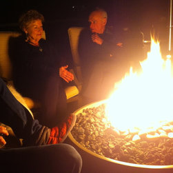 Hemi Fire Pit in use at a client's property - Fire Pits