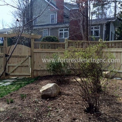 stockade deluxe with deck rail and arbor - Home Fencing And Gates