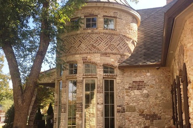 Example of a tuscan exterior home design in Austin