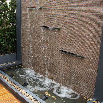 Gold Teak Deck with Modern Water-Wall Feature