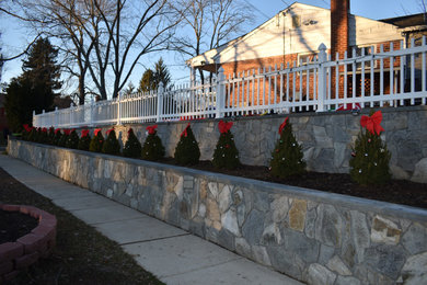 fence and concrete stone wall