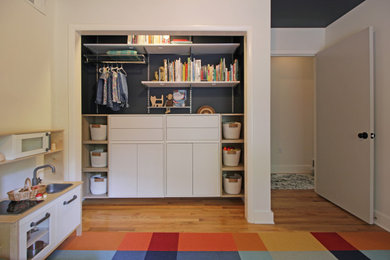 Inspiration for a small modern gender-neutral kids' room remodel in DC Metro with blue walls